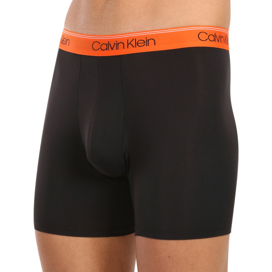 3PACK Boxershorts för herrar Calvin Klein svart (NB2570A-GTK)