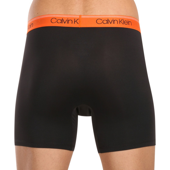 3PACK Boxershorts för herrar Calvin Klein svart (NB2570A-GTK)