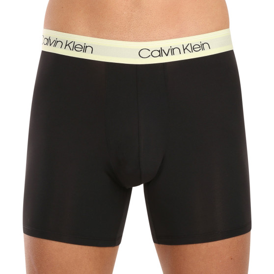 3PACK Boxershorts för herrar Calvin Klein svart (NB2570A-GTK)