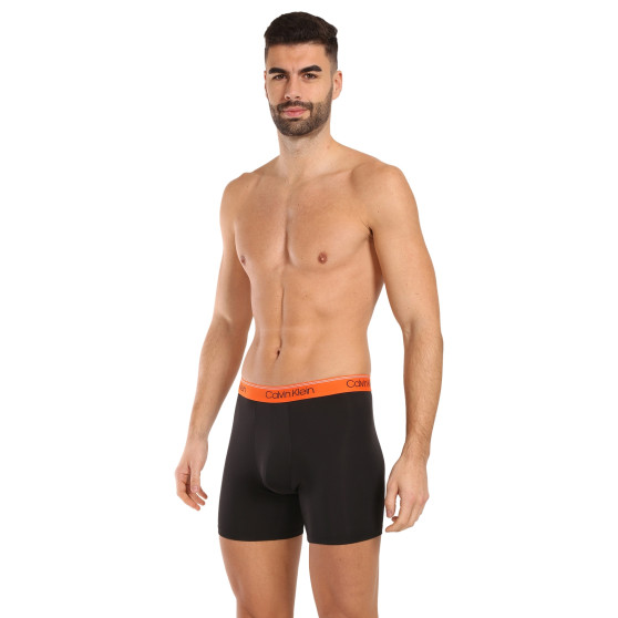 3PACK Boxershorts för herrar Calvin Klein svart (NB2570A-GTK)