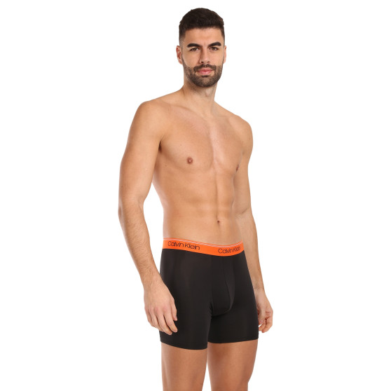 3PACK Boxershorts för herrar Calvin Klein svart (NB2570A-GTK)