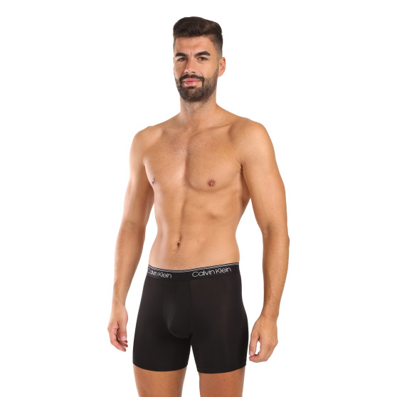 3PACK Boxershorts för herrar Calvin Klein svart (NB2570A-Q84)